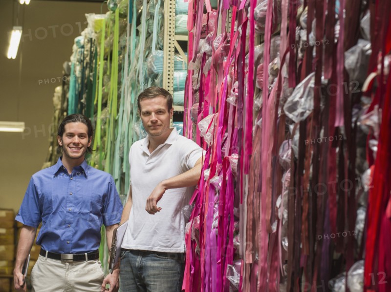 Workers smiling in textile factory