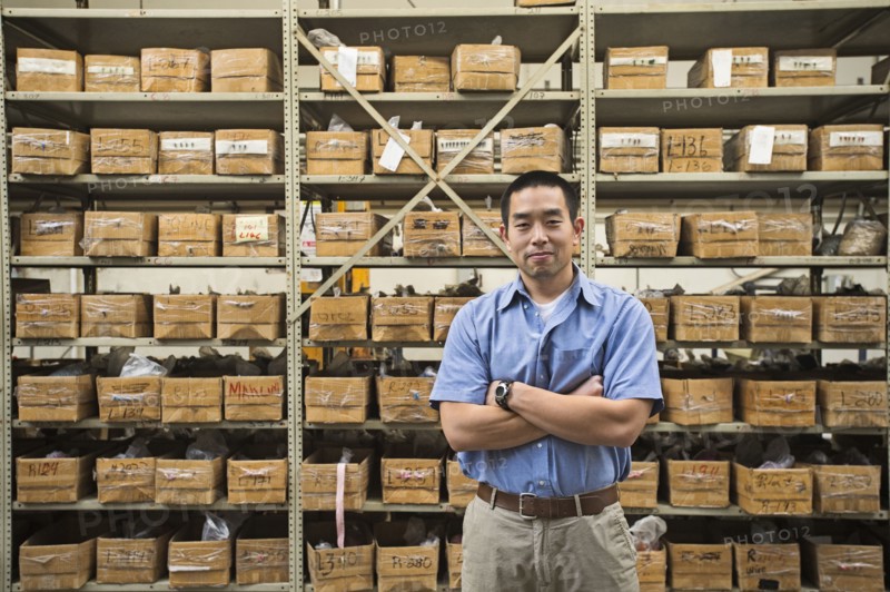 Chinese worker smiling in textile factory