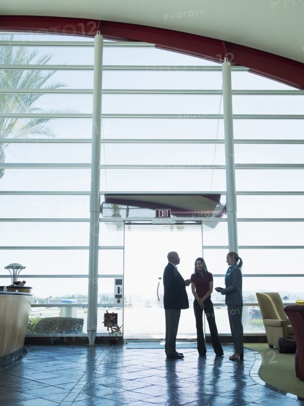 Business people talking in airport