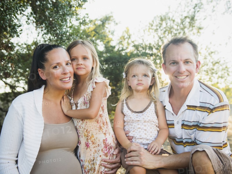 Family smiling together outdoors
