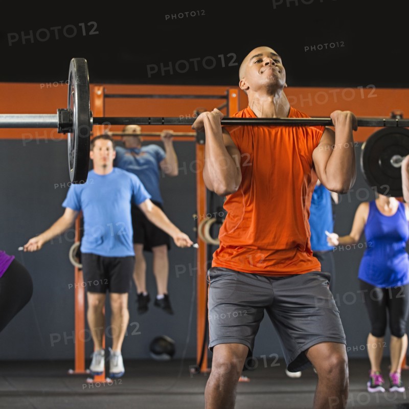 Man lifting weights in gym