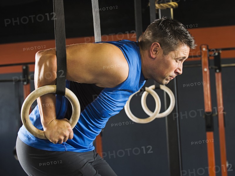 Caucasian man working out in gym