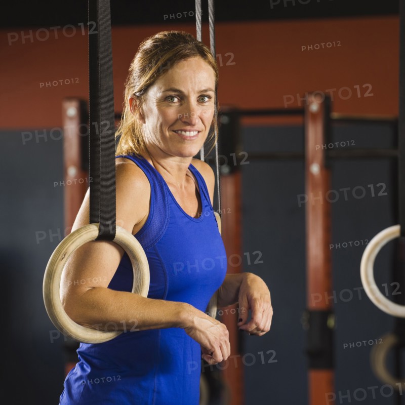 Caucasian woman resting in gym