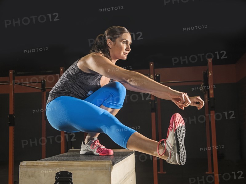 Caucasian woman exercising in gym