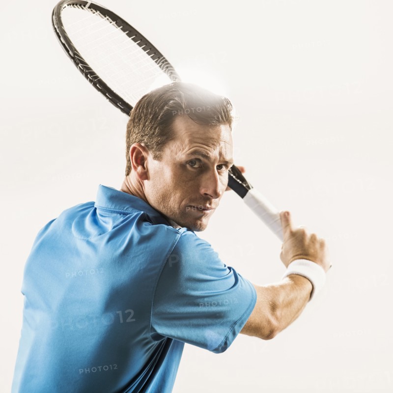 Caucasian man playing tennis