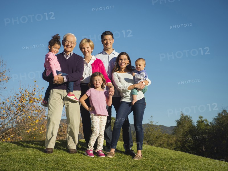Family smiling together outdoors