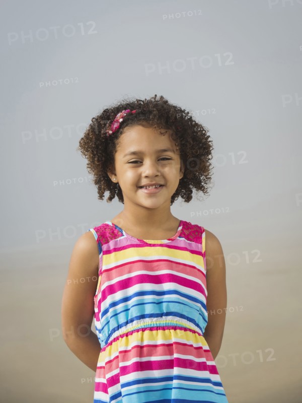 Black girl smiling on beach