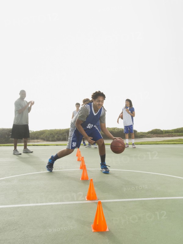 Basketball team doing drills at practice