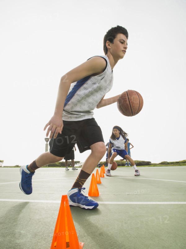 Basketball team doing drills at practice