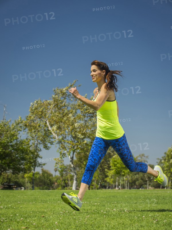 Mixed race woman jogging in park
