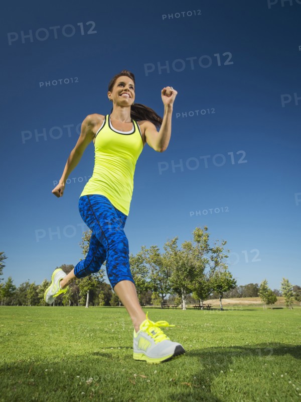 Mixed race woman jogging in park
