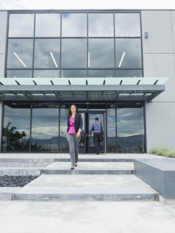 Businesswoman walking outside office building