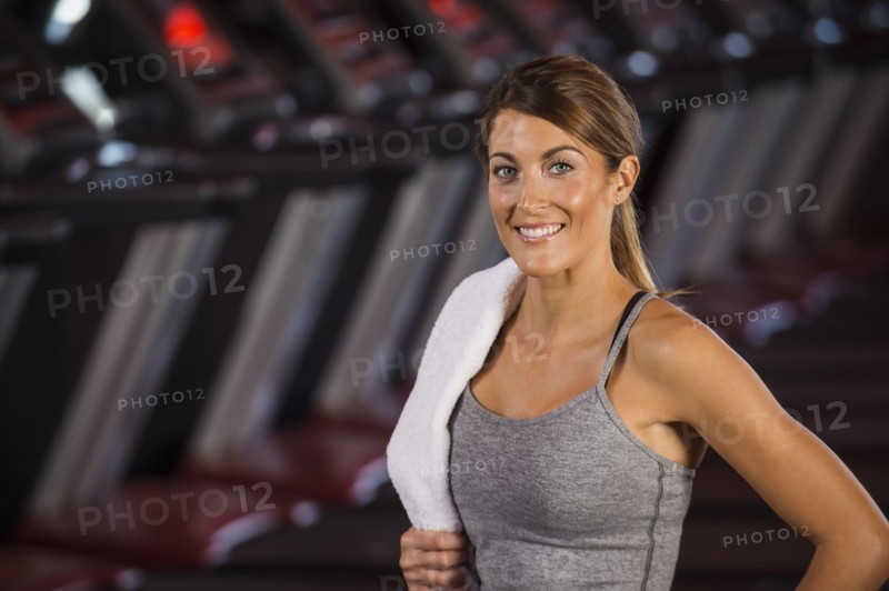 Caucasian woman standing in gym