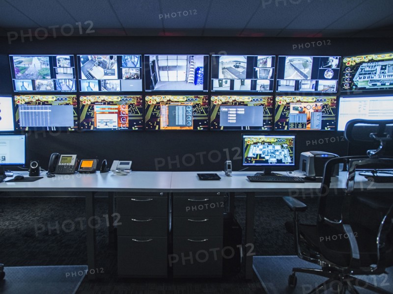 Monitors and empty desk in control room