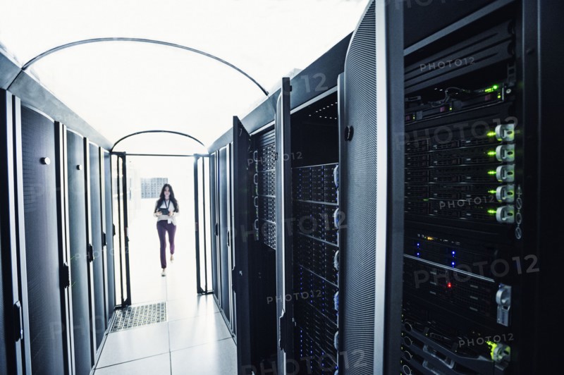 Technician walking in server room