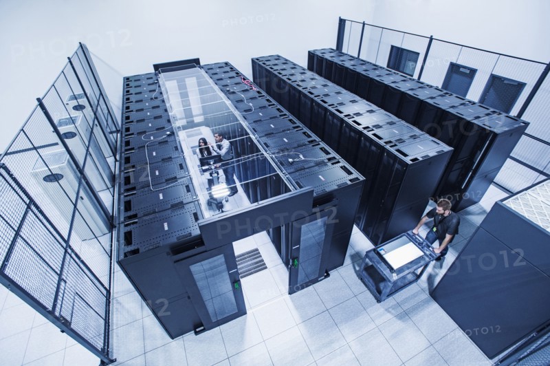 High angle view of technicians working in server room