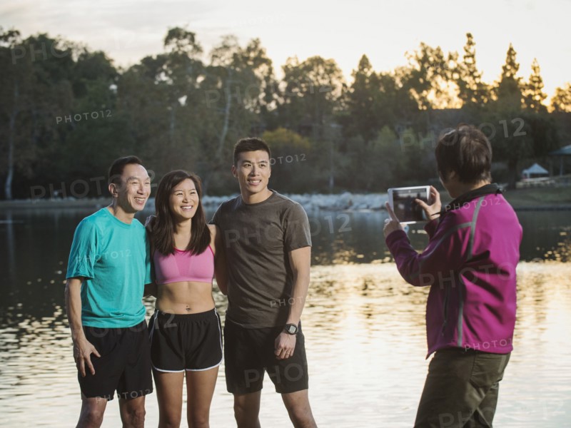 Chinese family taking photograph in park