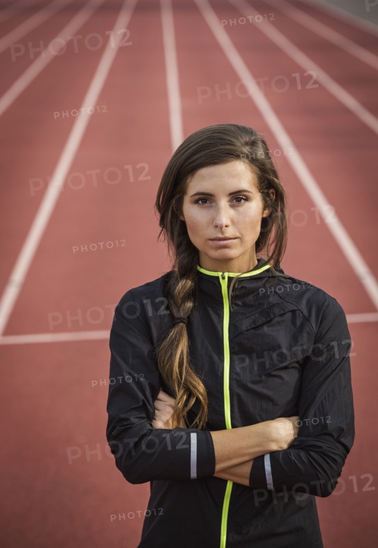 Caucasian woman posing on running track