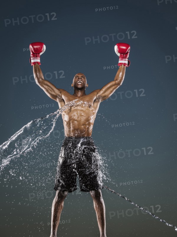 Water splashing on winning Black boxer