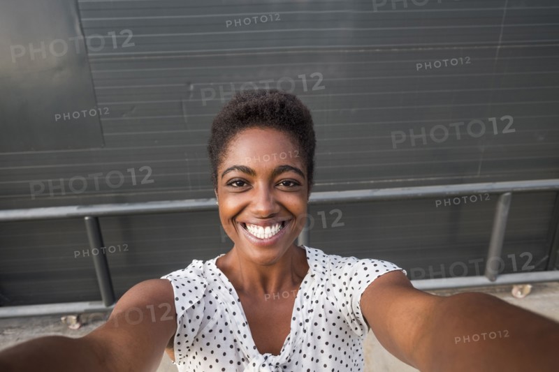 African American woman smiling for selfie