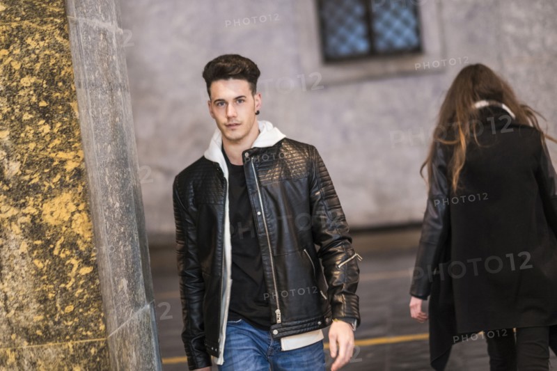 Caucasian man walking in city