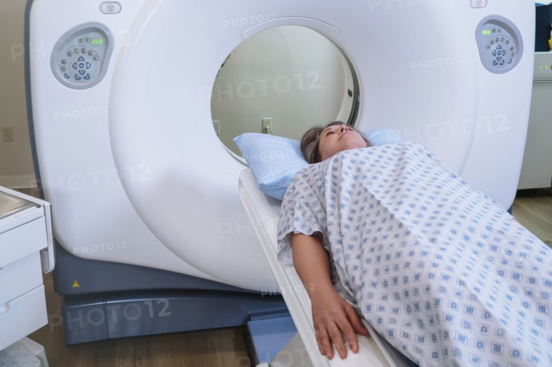 Caucasian patient laying on scanner table