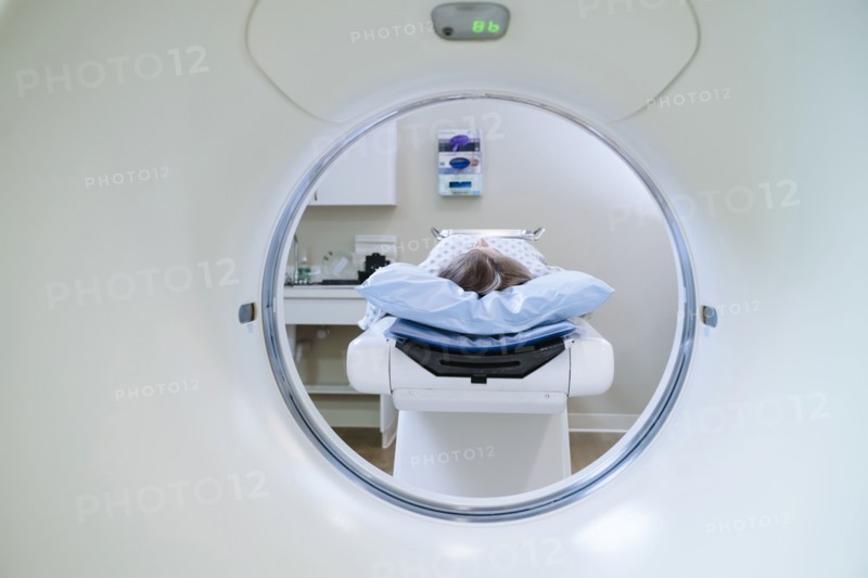 Caucasian patient laying on scanner table