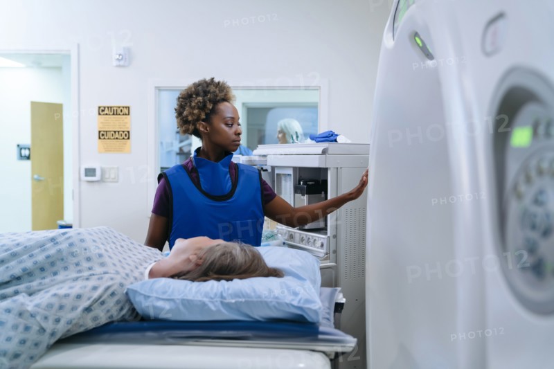 Technician preparing scanner for patient