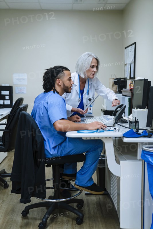 Doctor and nurse using computer