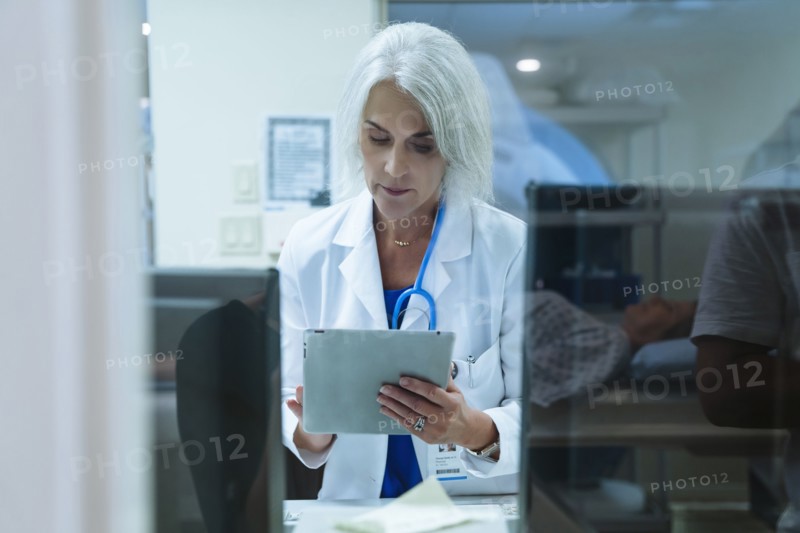 Doctor using digital tablet