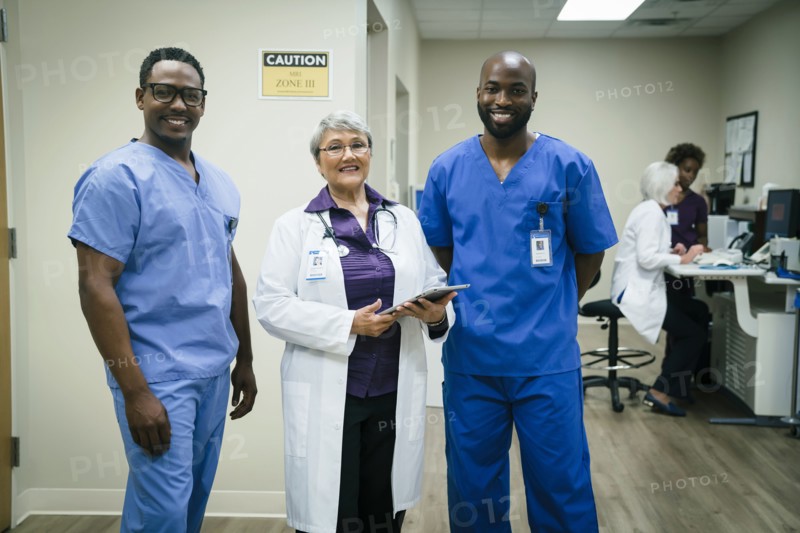 Portrait of smiling doctor and nurses