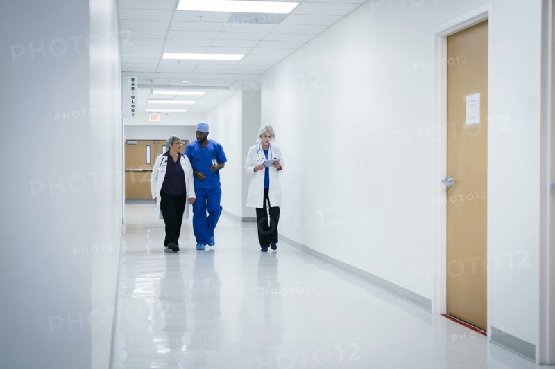 Doctors and nurse walking in hospital