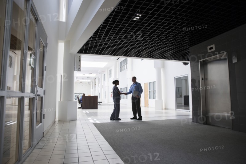 Doctor and nurse shaking hands