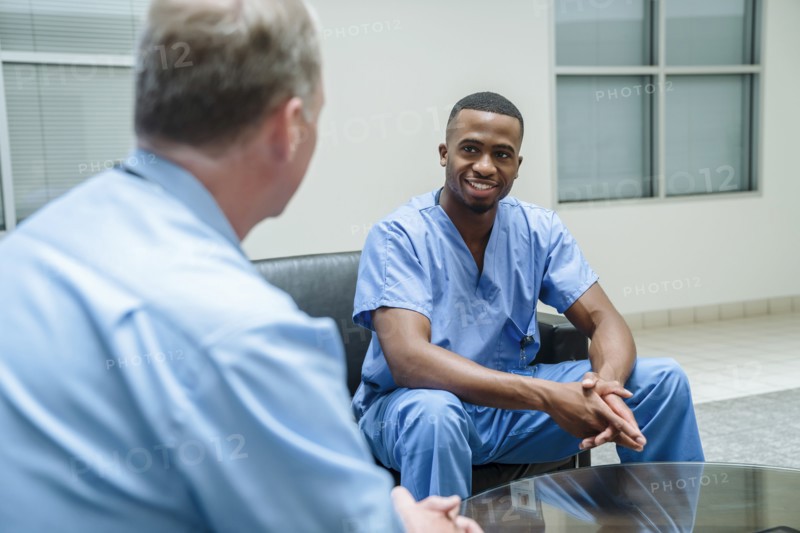 Doctor and nurse talking in lobby