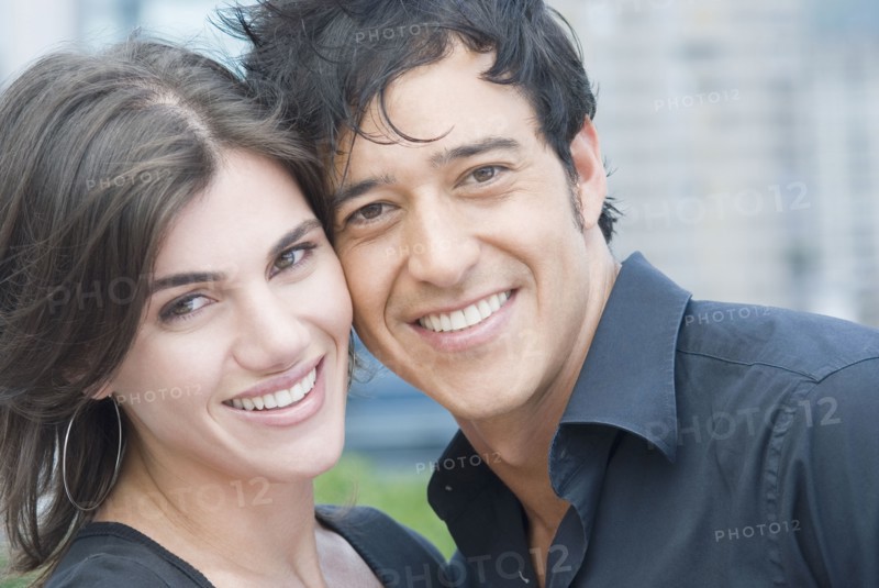 Close up of Hispanic couple smiling