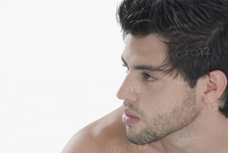 Profile of Hispanic man with bare shoulders