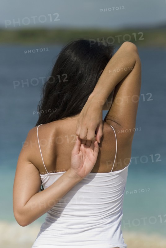 Hispanic woman stretching