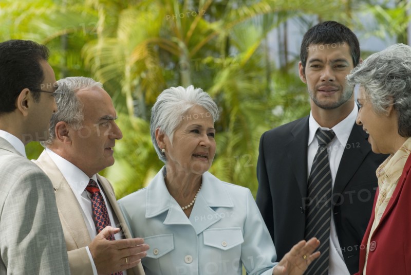 Hispanic businesspeople talking