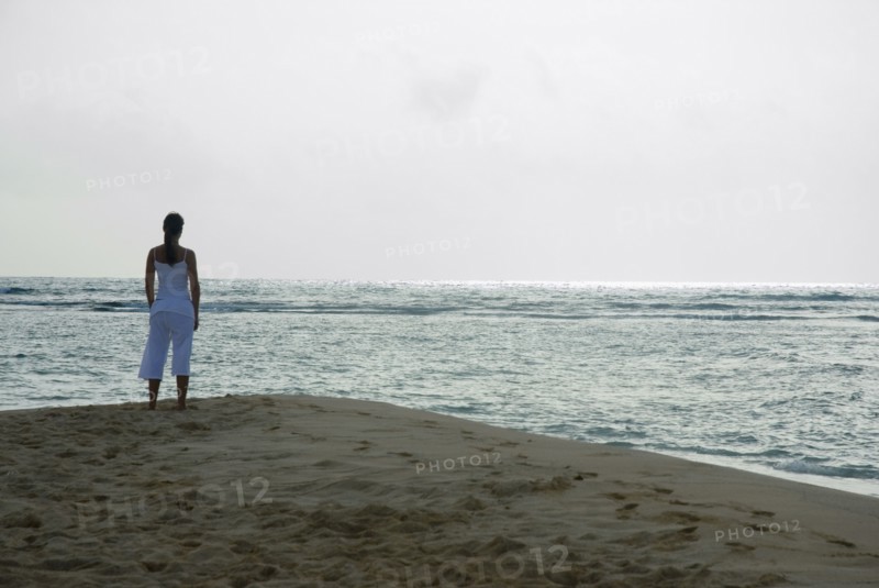 Woman looking out over ocean