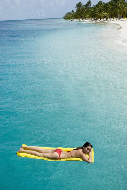 Woman on float in water