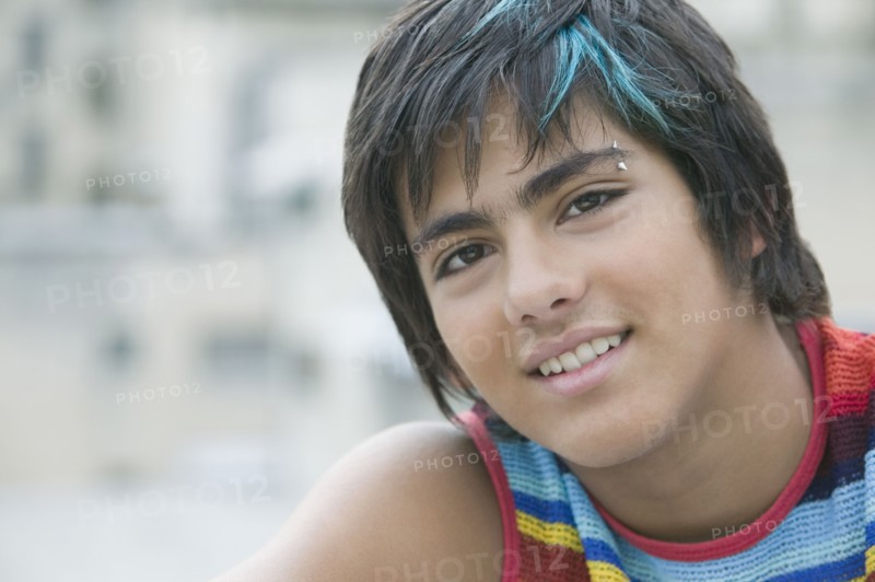 Hispanic teenager with eyebrow piercing