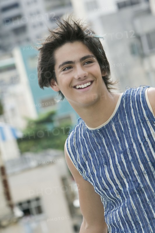 Hispanic teenager with eyebrow piercing