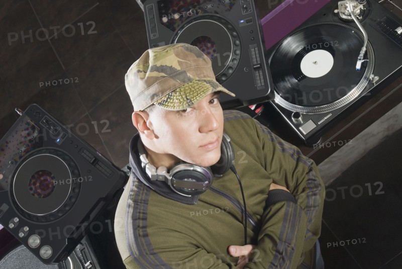 Hispanic DJ performing in nightclub