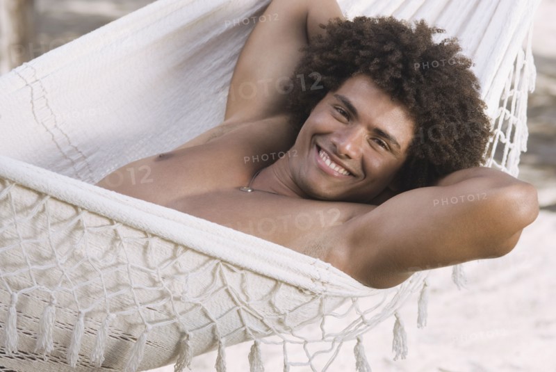 African man laying in hammock