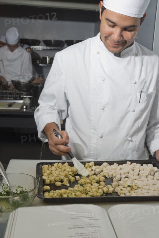 Baker working in bakery kitchen