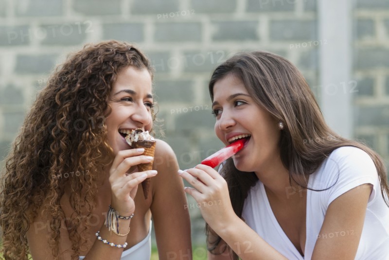 Hispanic friends eating ice cream together