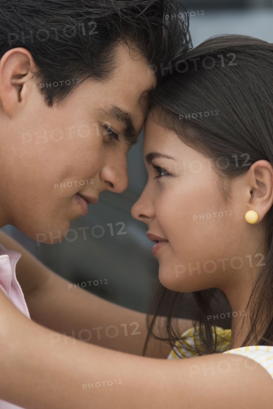 Hispanic couple hugging