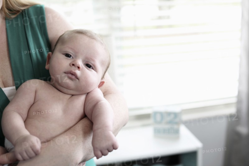 Mother holding baby son