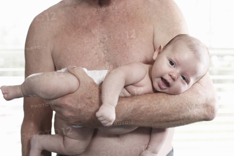 Father holding baby son