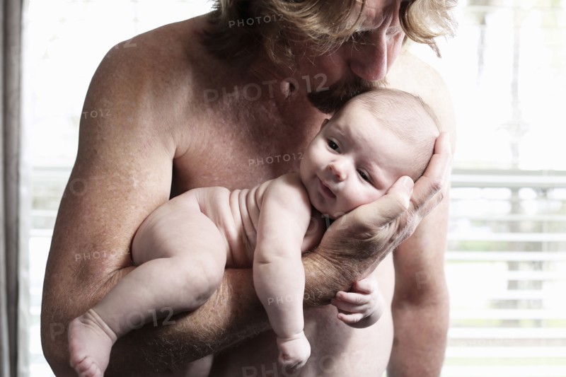 Father kissing baby son
